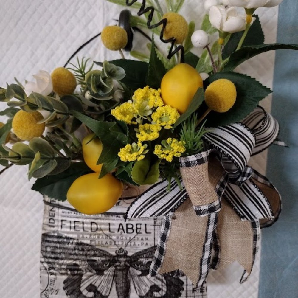 Tin can pocket with floral arrangement